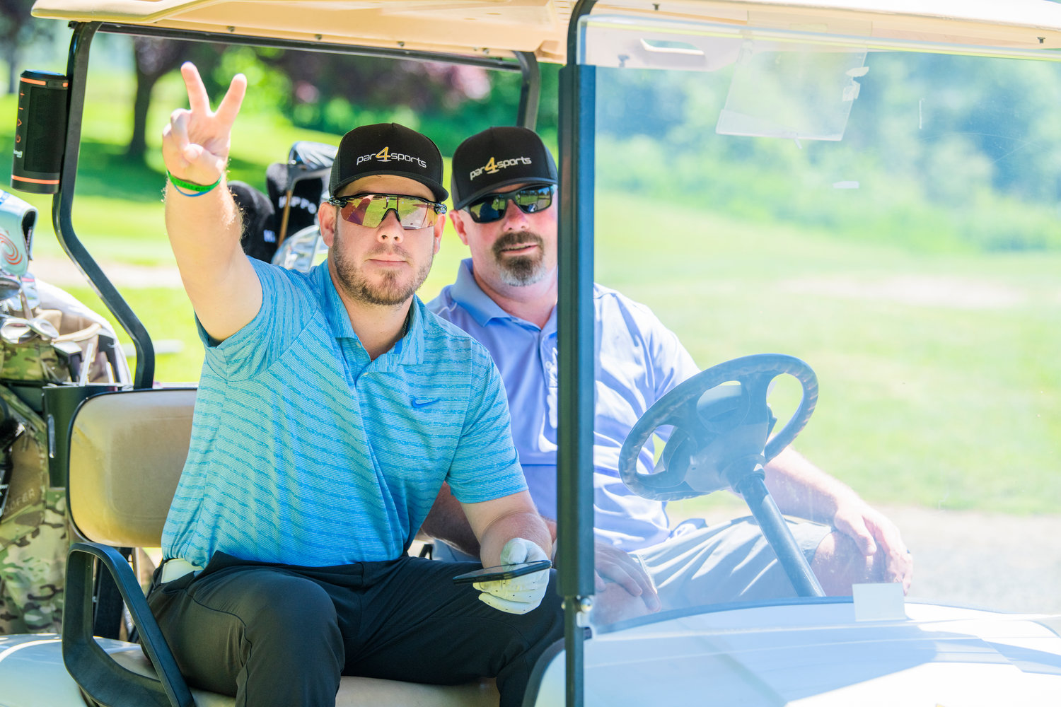 Professional golfer Brady Calkins, a W.F. West High School graduate, sports a Par 4 Sports hat after teeing off during a charity tournament at Riverside Golf Course in Chehalis on Friday. Calkins played in the U.S. Open last weekend.